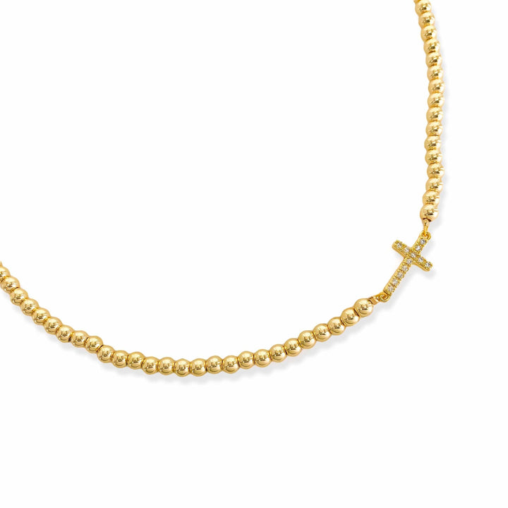 Gold Beaded Sideways Cross Necklace