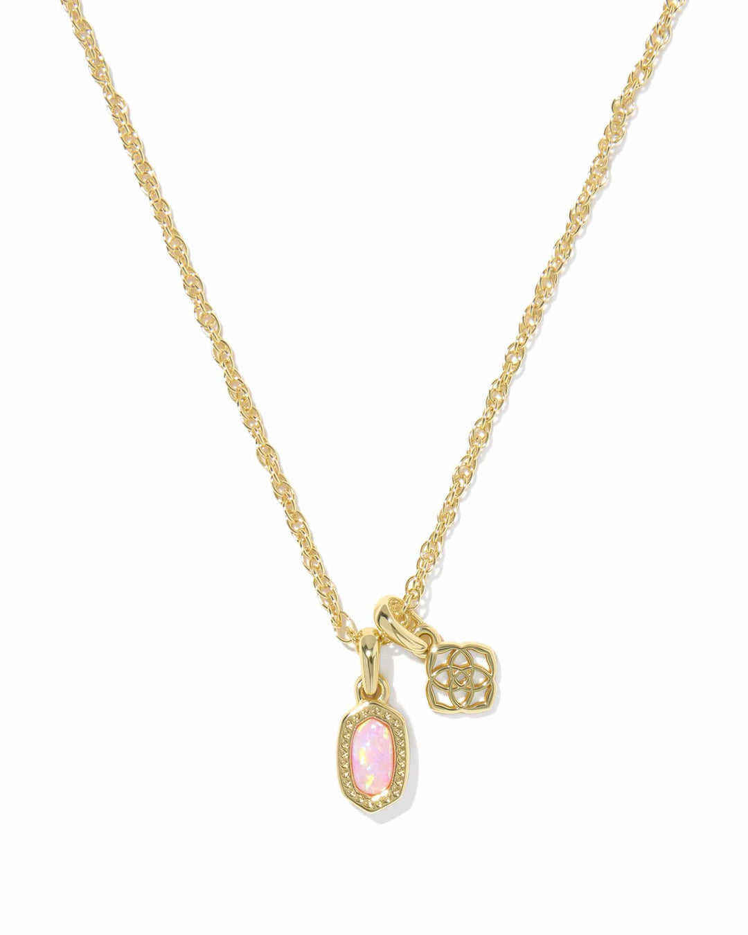 Gold necklace with pink gemstone pendant on a white background